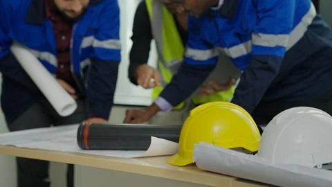 Construction engineers team using blueprint of project plan brainstorming Stock Photos