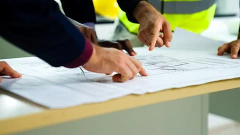 Construction engineers team using blueprint of project plan brainstorming 写真素材