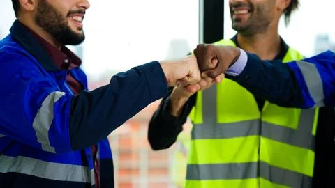 Construction engineers team using blueprint of project plan brainstorming Stock Photos