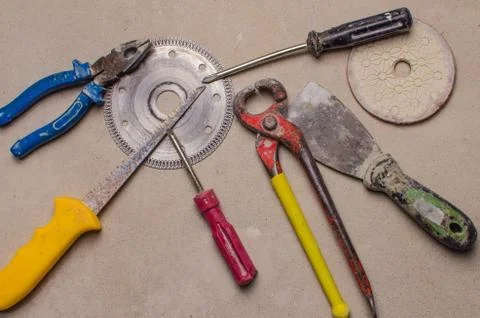Construction equipment on concrete background. Closeup. Tool for work Stock Photos
