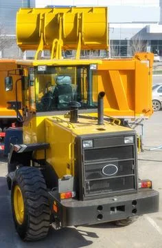 Construction Equipment front loader loading the truck (all logos, inscript... Stock Photos