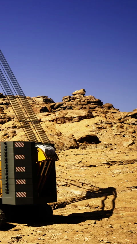 Construction equipment operates in desert area with rocky formations present Stock Footage 331755762