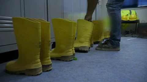 Construction equipment, safety boots in locker room Stock Footage 54466136