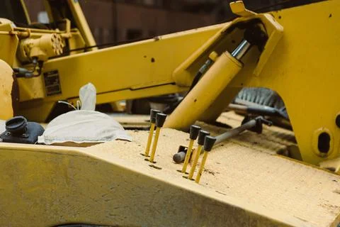 Construction equipment in use at a construction site during daylight hours .. Stock Photos