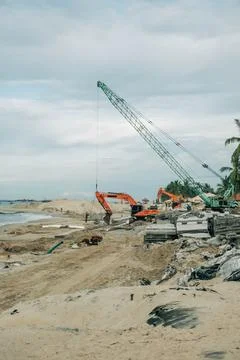 Construction equipment working on a beach in Vietnam Foto stock