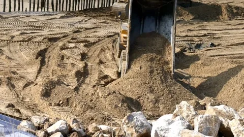 Construction Excavator Dumping Dirt Moving Earth at Work Site 4K Stock Footage 330481144