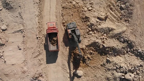 Construction excavator work at the industrial quarry. A machine with bucket l Stock Footage 126775861