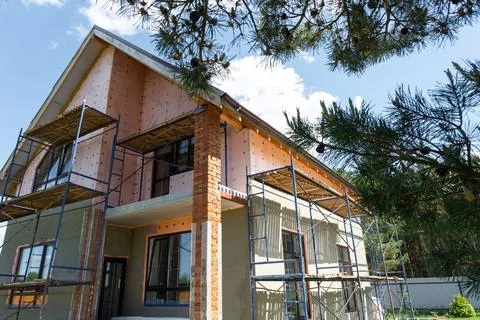 Construction with external render, facade insulation stage, wall plaster, s.. Stock-Fotos