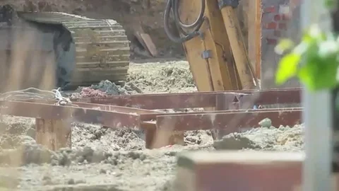 Construction extravator digging in the ground Stock Footage 98247798