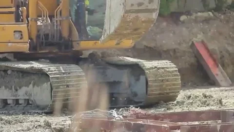 Construction extravator digging in the ground Stock Footage 98247801