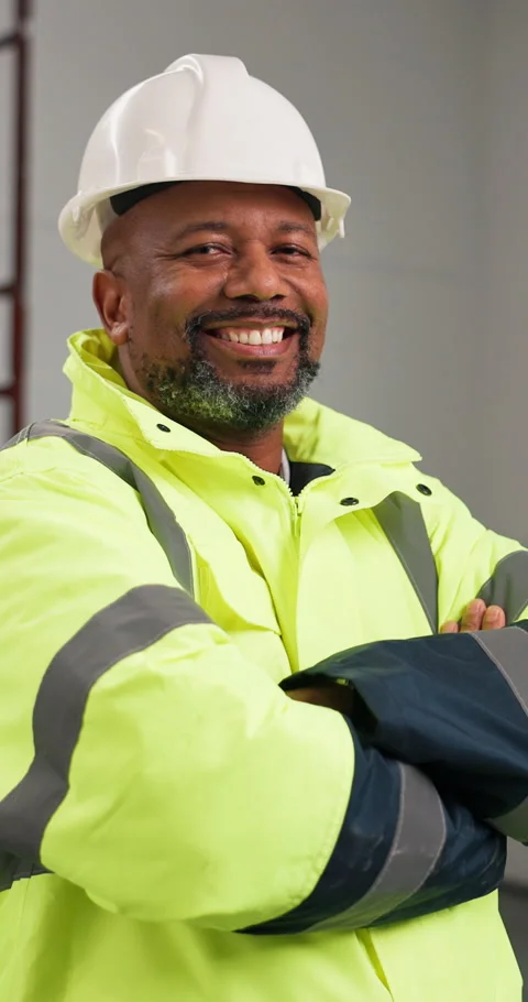 Construction, face and black man with arms crossed, site manager and pride as Stock Footage 347258155
