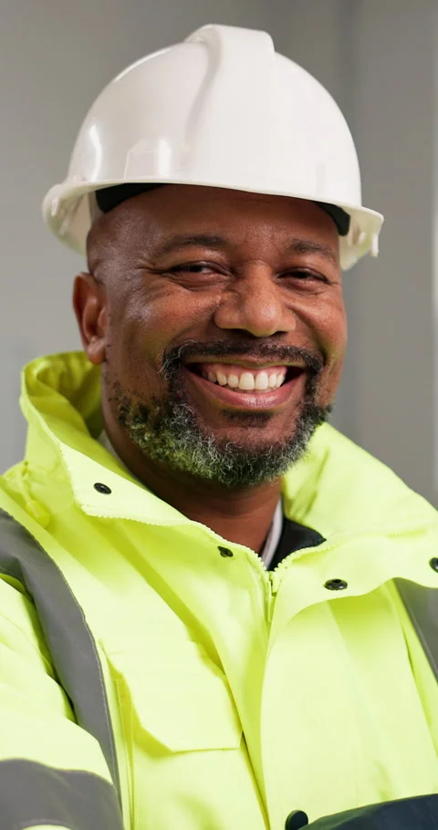 Construction, face and black man with smile, site manager and about us as Stock Footage 347341209