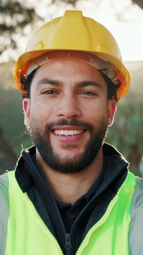 Construction, face and happy man outdoor with helmet, contractor and about us in Stock Footage 346939287