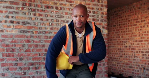 Construction, face or black man on worksite with hard hat, about us or ambition Stock Footage 336262844