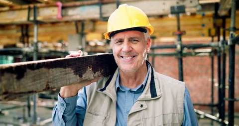 Construction, face or man on worksite with plank, positive attitude or pride as Stock Footage 337016131