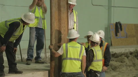 Construction Foreman Giving Instruction To Workers On Construction Site 2 Stock Footage 46594102