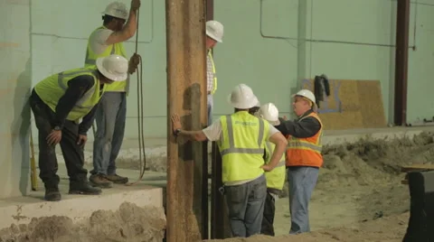 Construction Foreman Giving Instruction To Workers On Construction Site 3 Stock Footage 46594460