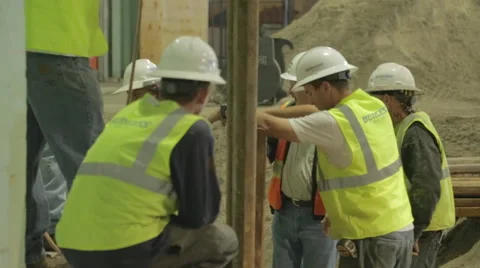 Construction Foreman Giving Instruction To Workers On Construction Site 4 Stock Footage 46594593
