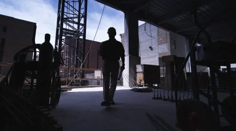 Construction Foreman walks to camera Stock Footage 62887598