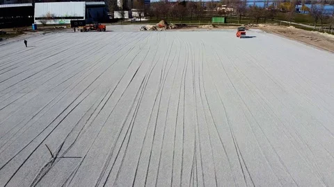 The construction of the foundation of the stadium, pavers rides in the frame Stock Footage 128363944