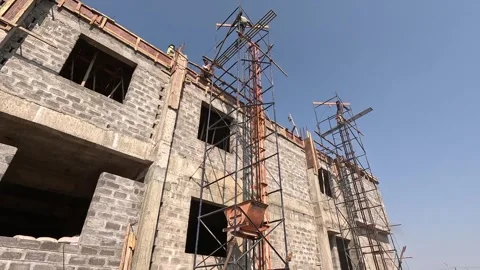 Construction Framework and Scaffolding at Unfinished Industrial Building Site Stock Footage 343909826