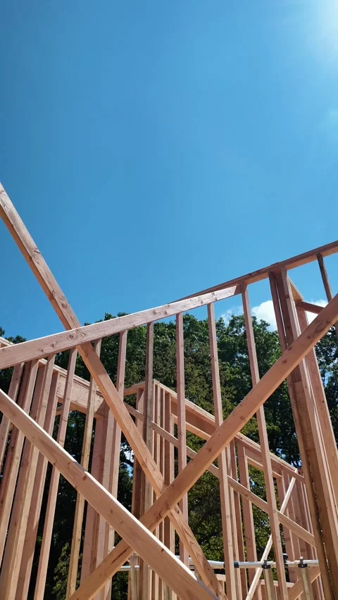 Construction Framing Under a Clear Sky in the Afternoon Stock Footage 282330707