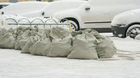 Construction garbage in bags lying in the snow 動画素材 81047392