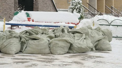 Construction garbage in bags lying in the snow 動画素材 83228333
