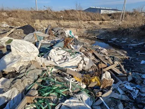 Construction garbage at the landfill, environmental pollution Stock Photos