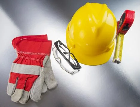 Construction Gear on Silver Tabletop with Hardhat  Foto stock
