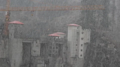 Construction of giant dam on river Parvati, driving snow. India Stock Footage 89394157