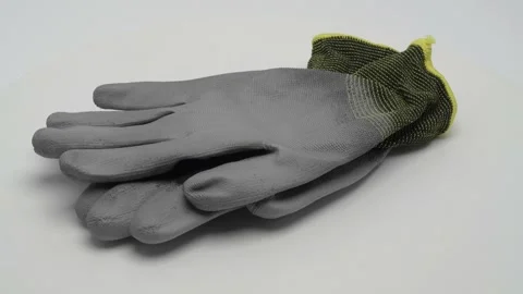 Construction gloves on a white background. 스톡 동영상 265433204