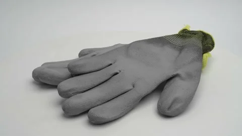 Construction gloves on a white background. Stockbeeldmateriaal 265864801