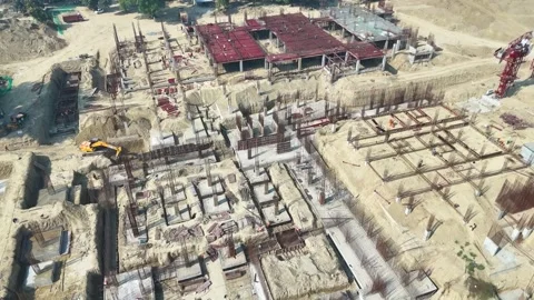 Construction going on with unfinished projects with people working on them Stock Footage 299825283