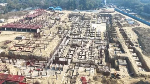 Construction going on with unfinished projects with people working on them Stock Footage 299825284