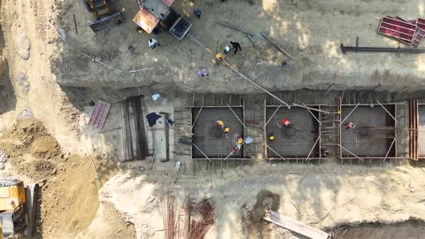 Construction going on with unfinished projects with people working on them Stock Footage 299825592