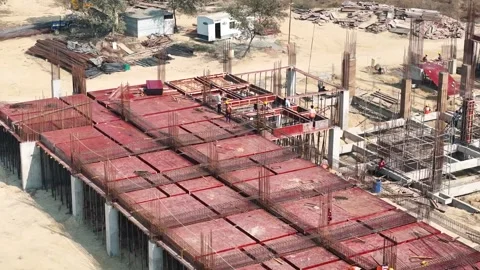 Construction going on with unfinished projects with people working on them Stock Footage 299825603