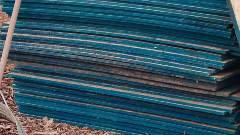Construction Grade Plywood Stack with Treated Blue Edges Stock Footage 345175598