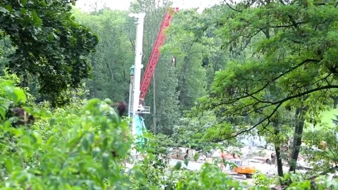 Construction in the green area of the suburb Stock Footage 97267992