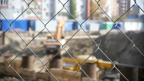 Construction grid in focus, with a blurred background of construction in the Stock Footage 81714427