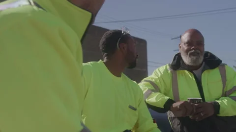Construction Guys Sit Chatting Outside On Sunny Day Stock Footage 270389805