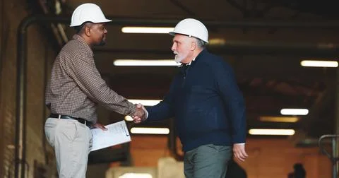 Construction, handshake or men with safety inspection, building deal or approval Stock Photos