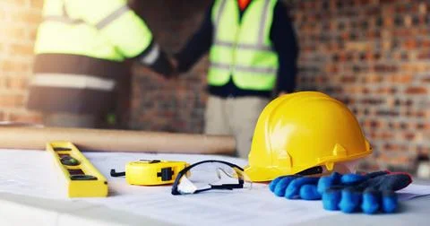 Construction, handshake or men with safety inspection, building deal or app.. Stock Photos