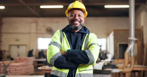 Construction, happy and face of man with crossed arms, confidence or ppe for Stock Footage 337987423