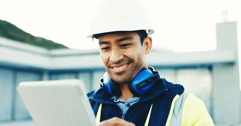 Construction, happy or man on site with tablet, permit approval or good news on Stock Photos