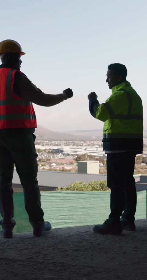 Construction, happy or team on site with fist bump, partner success or Stock Footage 336264042