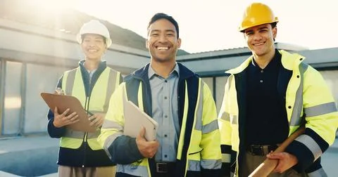 Construction, happy or team on site with portrait, about us or collaboration in Stock Photos