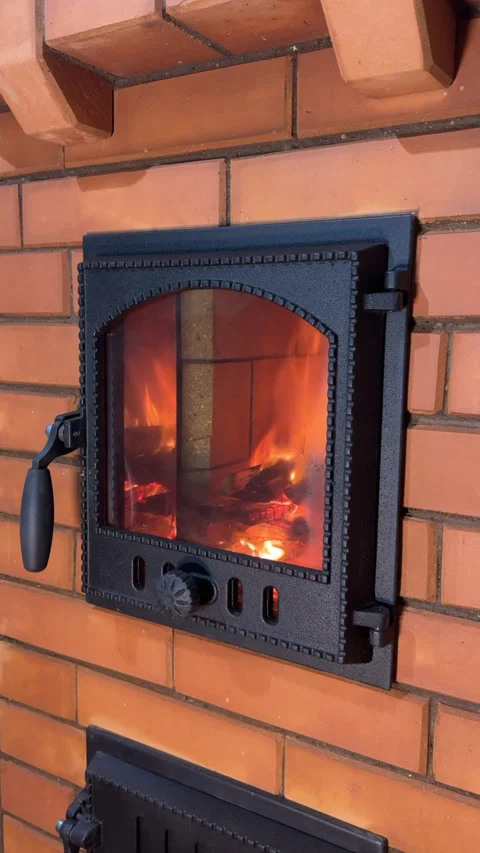 Construction of a heating stove. Test firing of the stove. Vertical video. Stock Footage 325620990