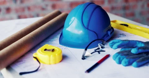 Construction, helmet and blueprint with tools on table, infrastructure schematic Stock Footage 336779079