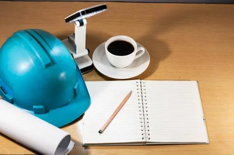 Construction helmet, coffee, working anytime, anywhere Stock Photos